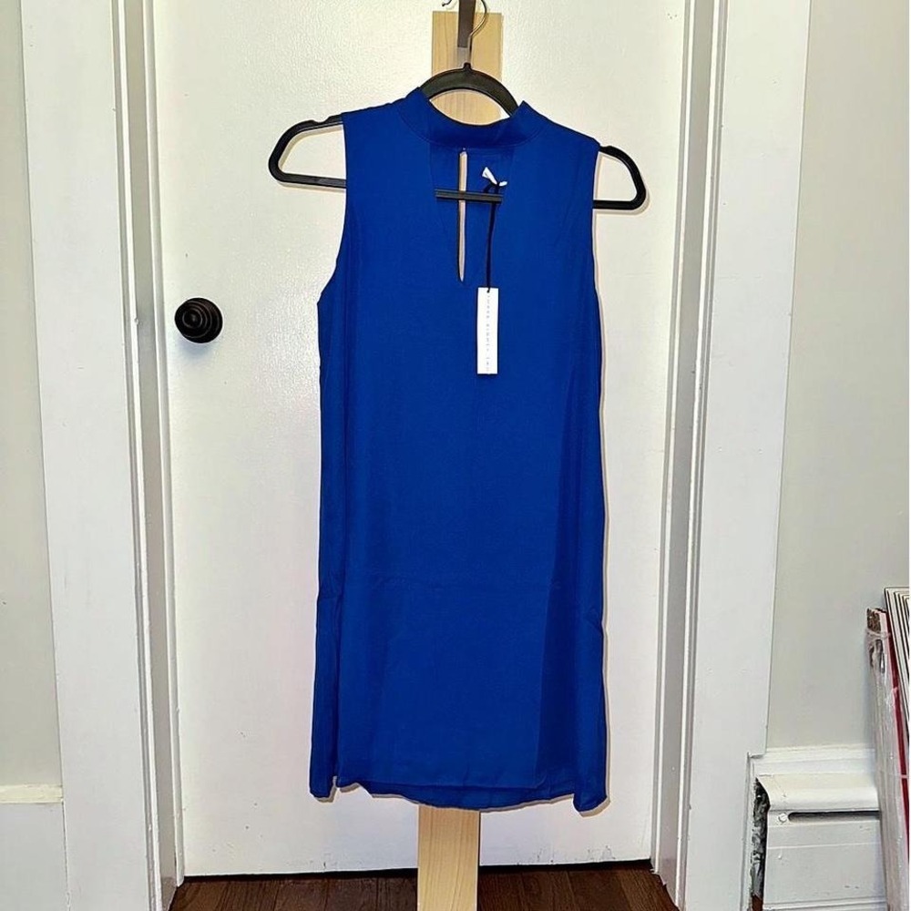 Three Eighty Two. Blue sleeveless dress with cut out detail and tie neck